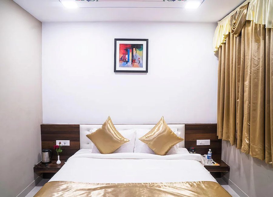 Deluxe Room bed and headboard